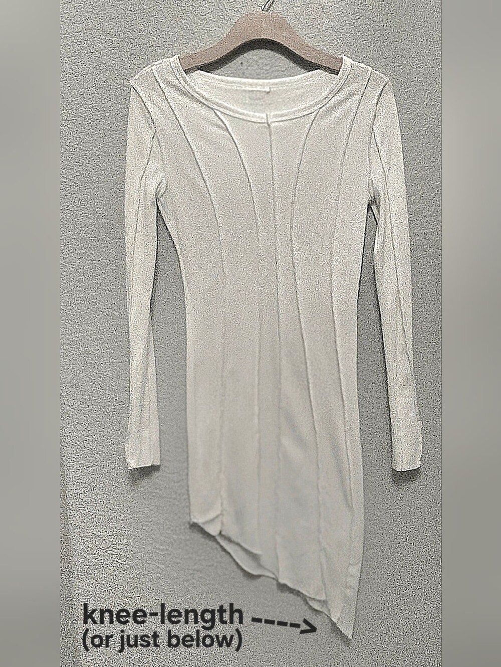 Asymmetric long-sleeve dress.